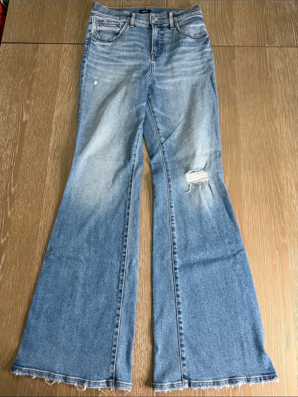 Gently used Express Women’s Light Blue 70s flare high rise Distressed Jeans